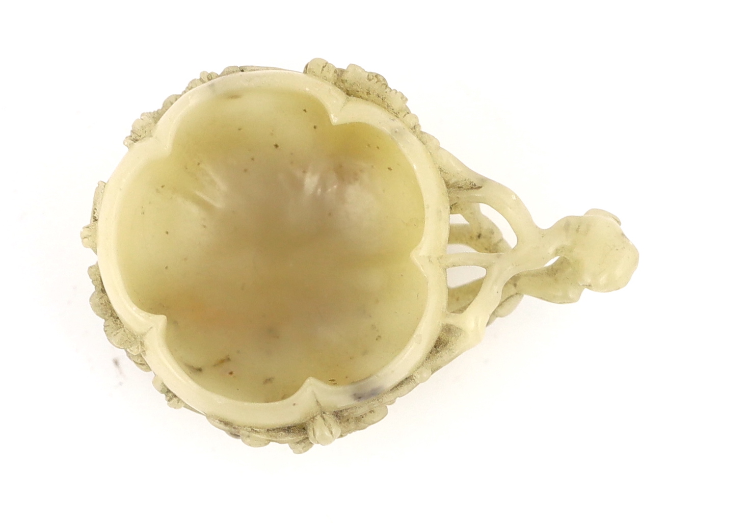 A Chinese creamy white soapstone ‘plum blossom’ cup, 18th/19th century, carved in high relief and open work with prunus branches and blossom, the stone of creamy white tone with some pale russet inclusions, 7.4cm across